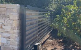 cantilever sliding gate opens into the tree line